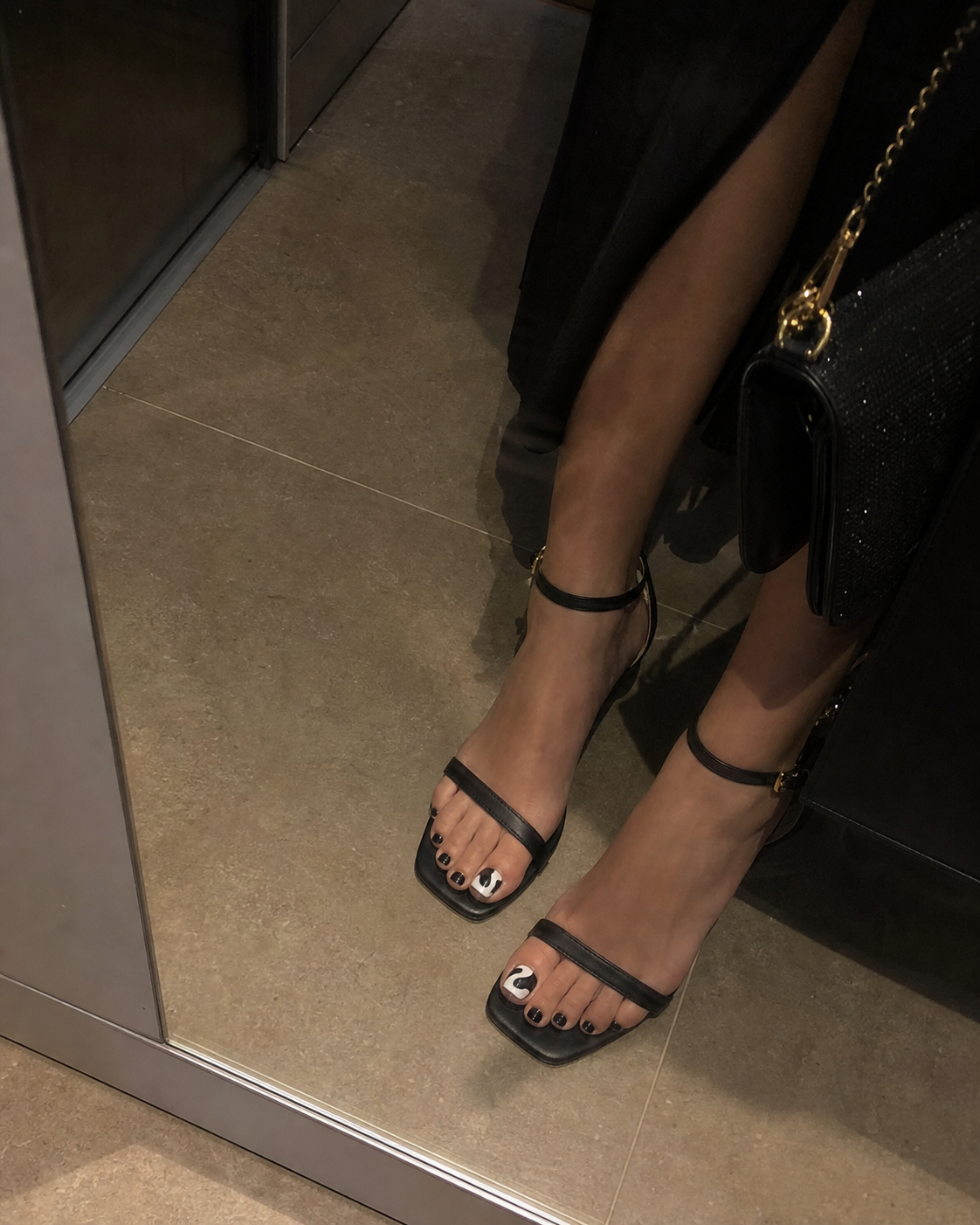 Elevator mirror phone photo of evening press-on nails